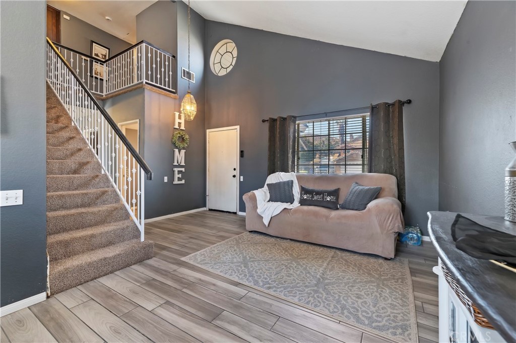 4144 Shellicia Circle Riverside, CA 92509 - Photo 9 of 33 a living room with furniture and a large window