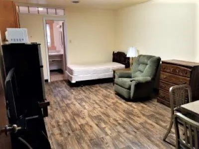 a living room with furniture and a window