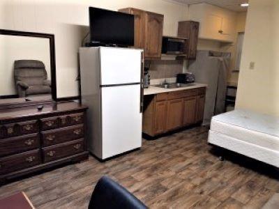 1700 Philadelphia Street Indiana, PA 15701 - Photo 2 of 5 a kitchen with stainless steel appliances a refrigerator stove and microwave