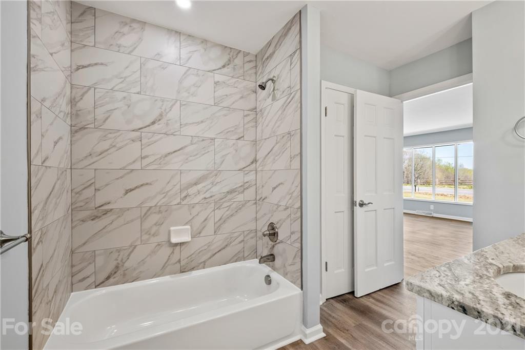 955 Potneck Road Salisbury, NC 28147 - Photo 14 of 28 a bathroom with a bathtub and a shower