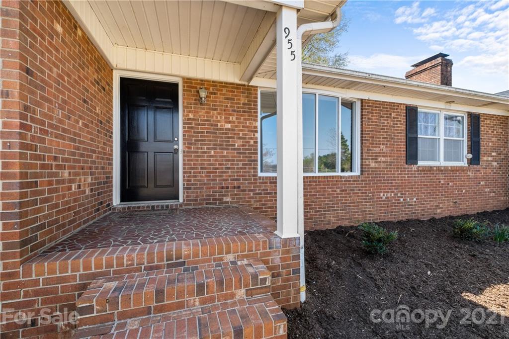 955 Potneck Road Salisbury, NC 28147 - Photo 23 of 28 a view of a brick house with many windows