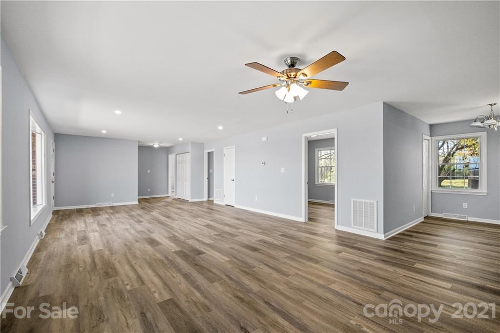 955 Potneck Road Salisbury, NC 28147 - Photo 6 of 28 a view of an empty room and window with wooden floor