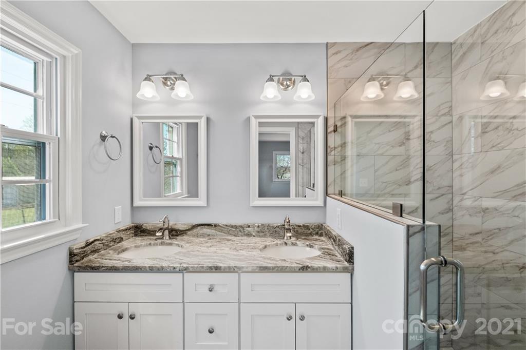 955 Potneck Road Salisbury, NC 28147 - Photo 10 of 28 a bathroom with a granite countertop sink and a mirror