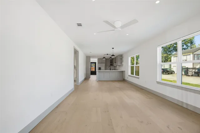 a view of a livingroom with furniture and windows