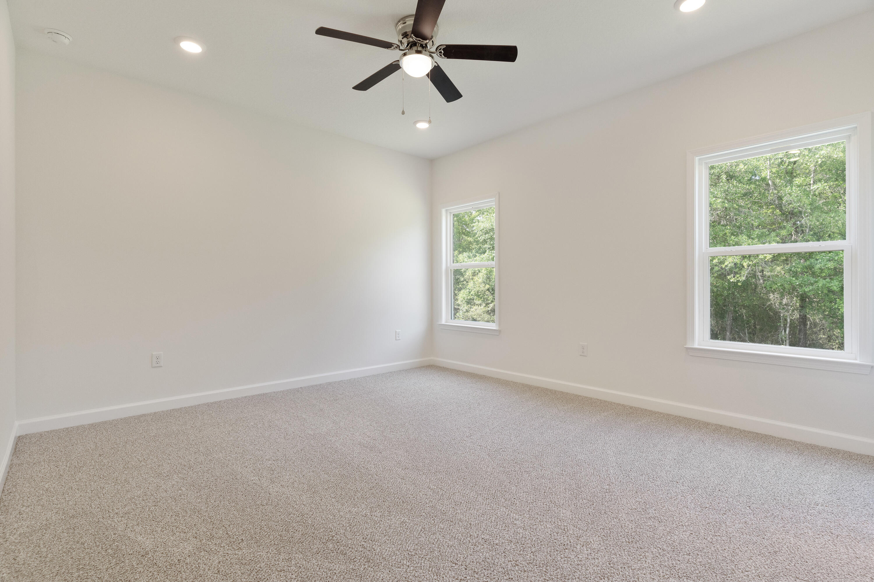 3202 Oxmore Drive Crestview, FL 32539 - Photo 12 of 20 an empty room with windows and fan