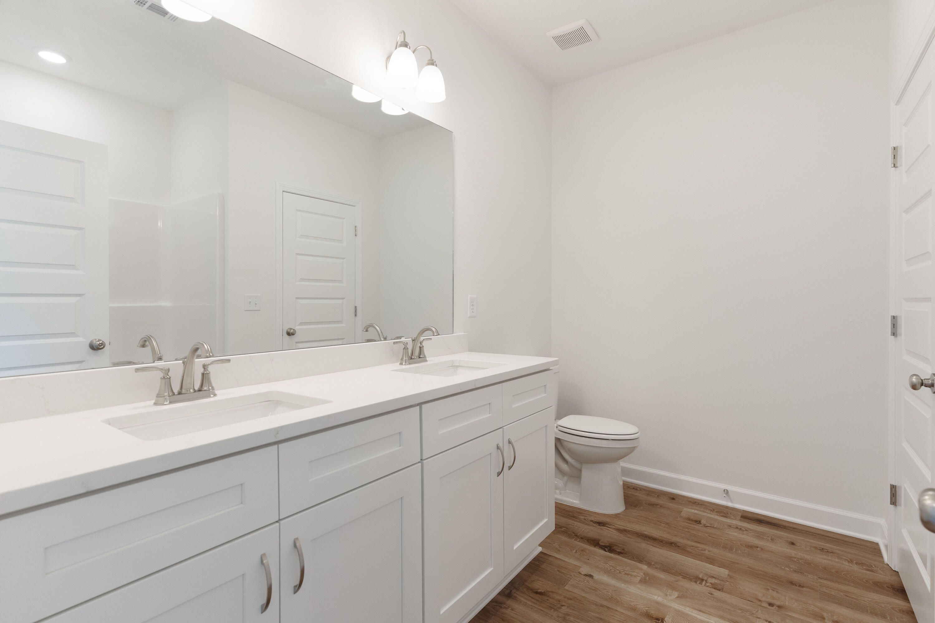 3202 Oxmore Drive Crestview, FL 32539 - Photo 13 of 20 a bathroom with a toilet sink and mirror