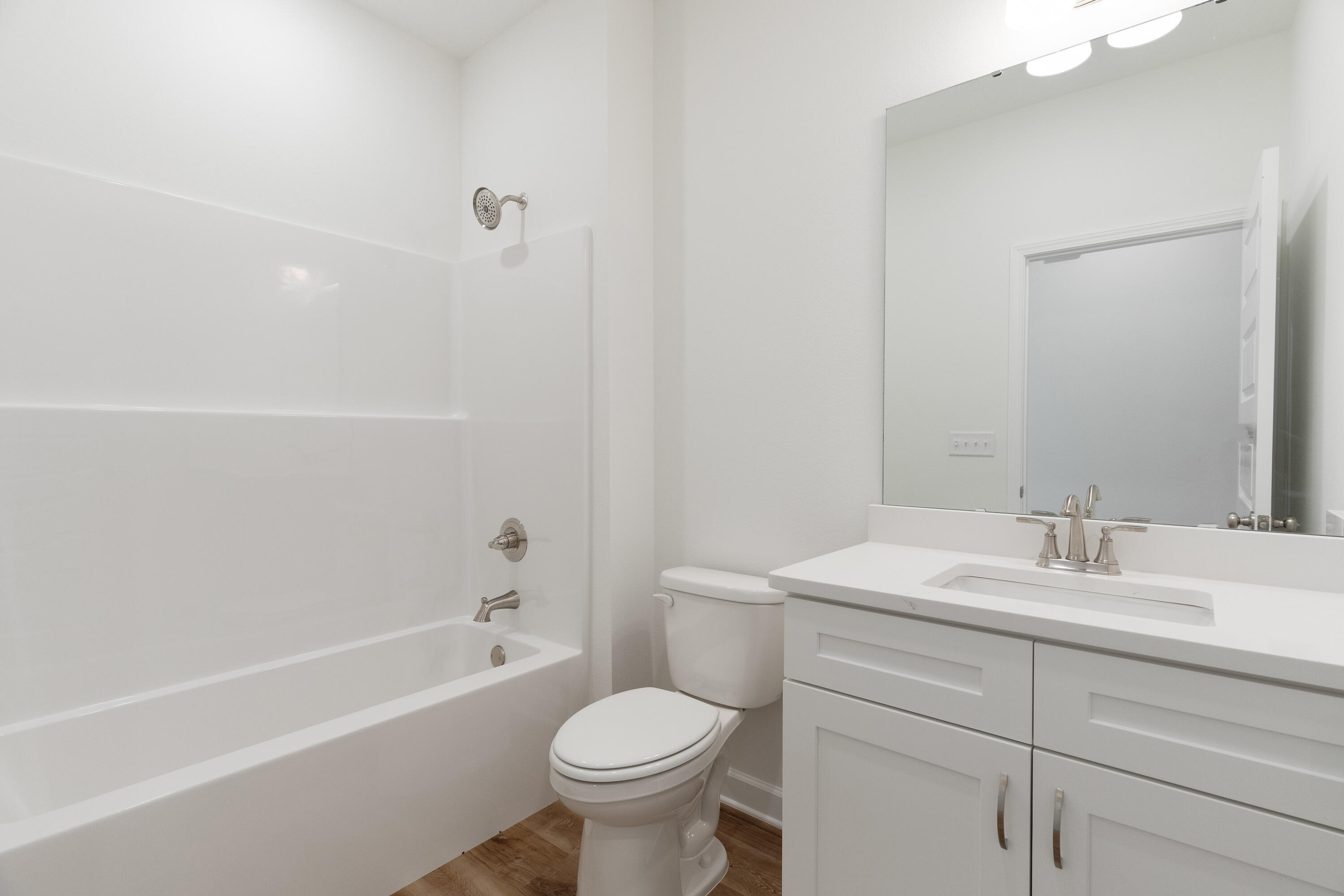 3202 Oxmore Drive Crestview, FL 32539 - Photo 16 of 20 a bathroom with a sink toilet vanity and shower