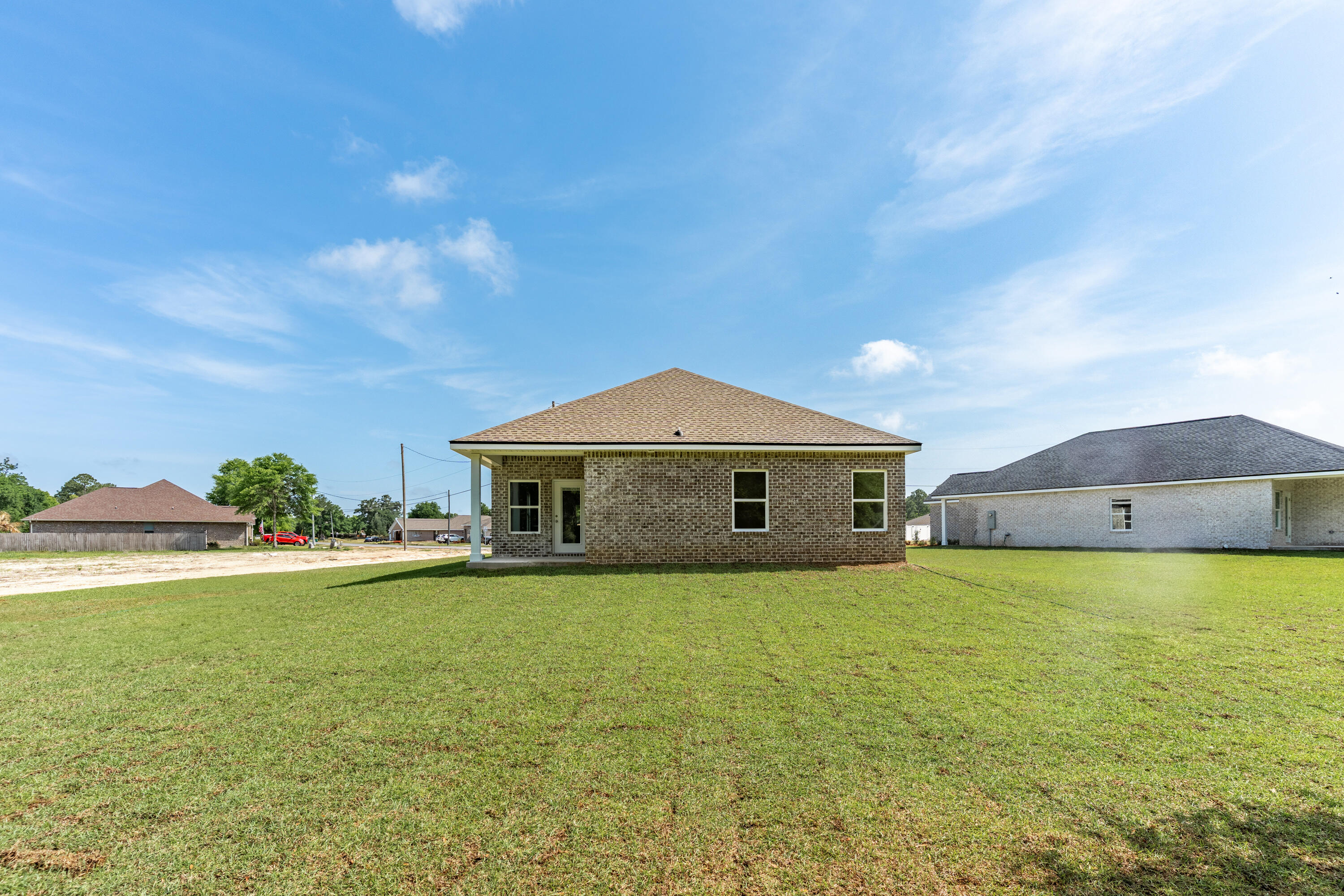 3202 Oxmore Drive Crestview, FL 32539 - Photo 19 of 20 a large house with a big yard and large trees