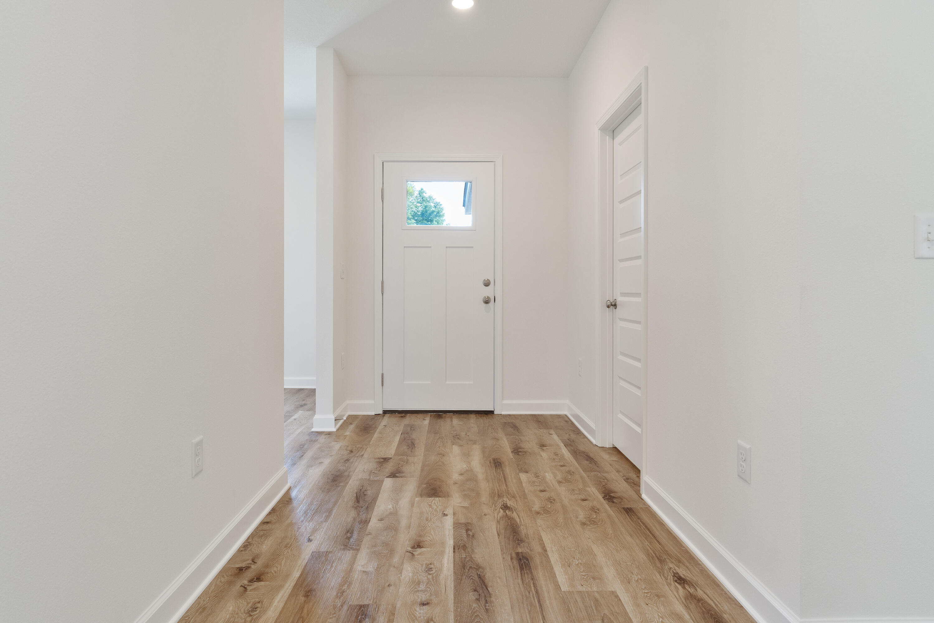 3202 Oxmore Drive Crestview, FL 32539 - Photo 2 of 20 a view of a room with wooden floor and white walls