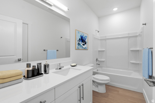 2085 North Main Street, Unit 216 Sunset, UT 84015 - Photo 6 of 12 Bathroom featuring a white vanity with integrated sink, chrome faucet, and expansive wall-mounted mirror