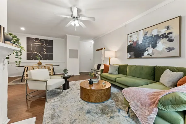 a view of a dining room with furniture and wooden floor