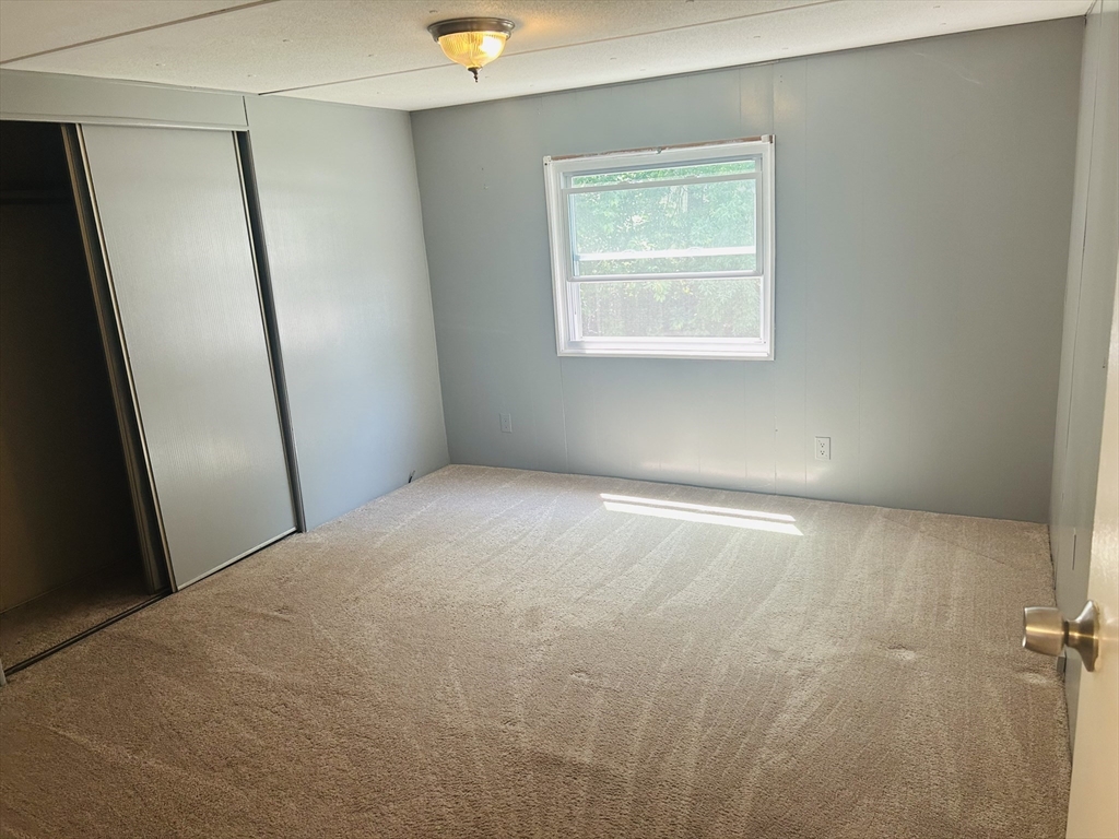 735 Memorial Drive, Unit 115 Chicopee, MA 01020 - Photo 4 of 8 an empty room with windows