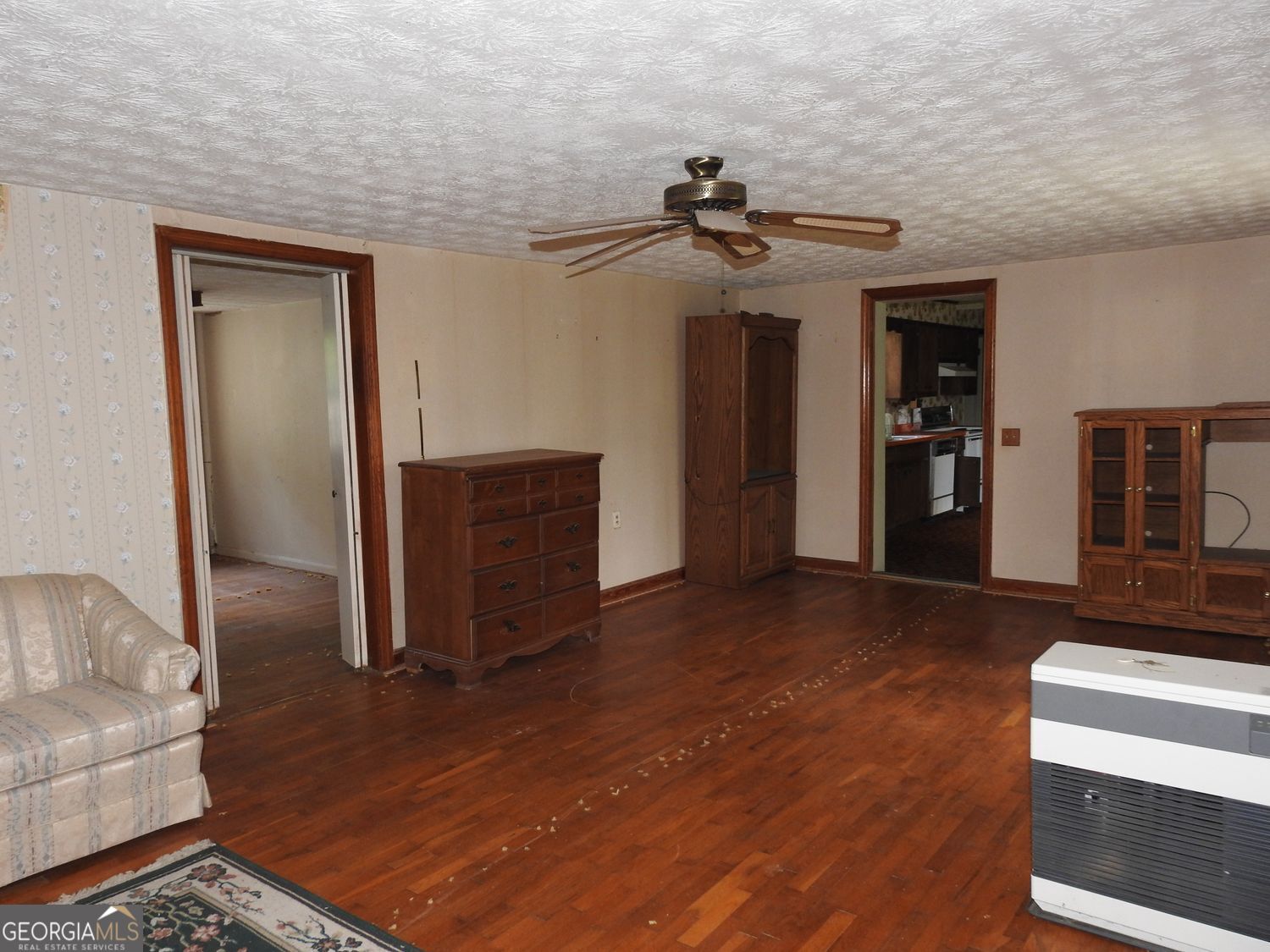 333 Lickskillet Road Epworth, GA 30541 - Photo 10 of 38 a view of a livingroom with furniture and wooden floor