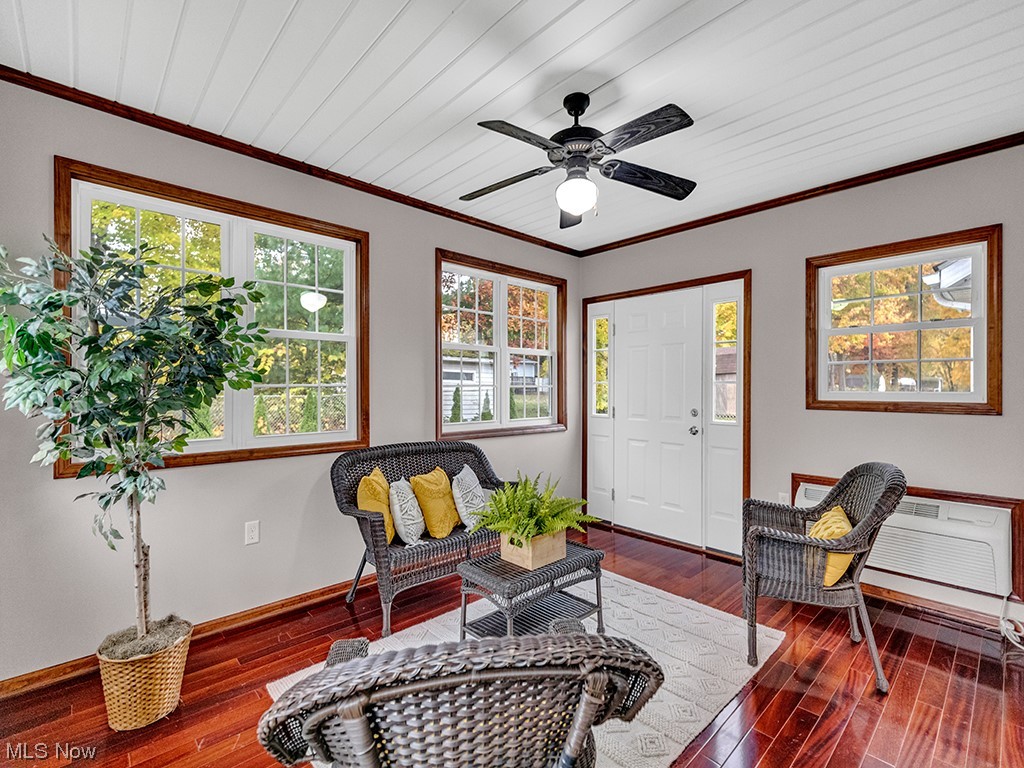 891 Susan Road Ravenna, OH 44266 - Photo 10 of 28 Sitting room with ceiling fan, crown molding, and dark wood-type flooring