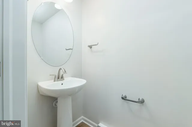 a view of a hallway with two rooms