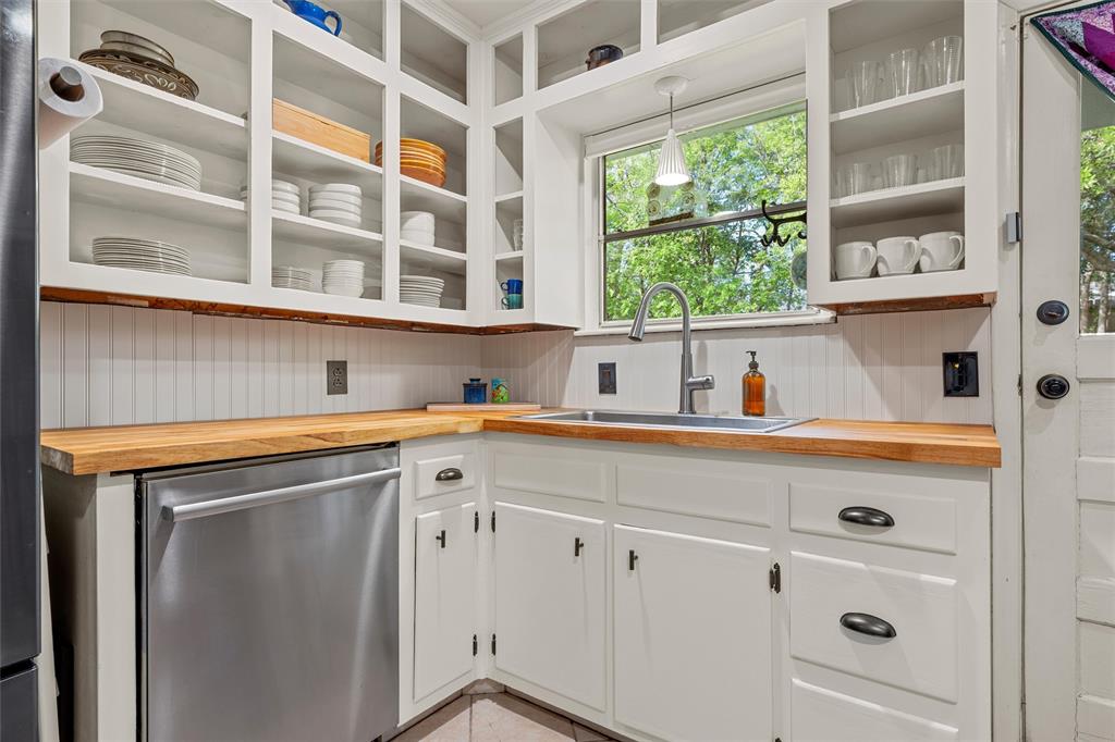 2216 Hermanson Drive Waco, TX 76710 - Photo 12 of 39 a utility room with cabinets and a window