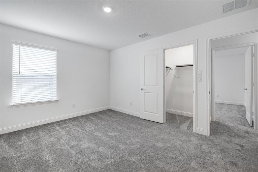 15024 Horseshoe Post Road Fort Worth, TX 76052 - Photo 21 of 31 an empty room with windows and closet