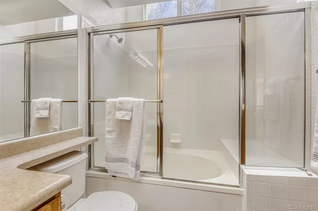 a bathroom with a shower and a sink