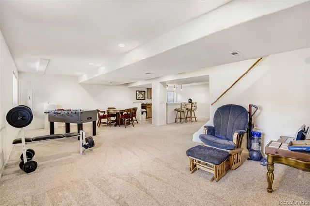 a living room with furniture gym equipment and a view of living room