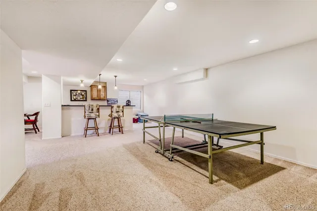 a room with furniture and bicycles