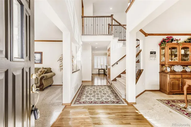 a view of entryway with furniture and rug