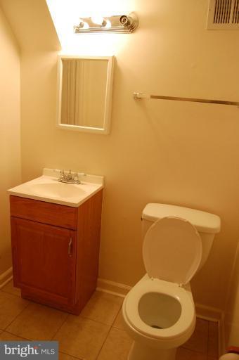 14300 Morton Hall Road Silver Spring, MD 20906 - Photo 13 of 18 a bathroom with a toilet and a sink