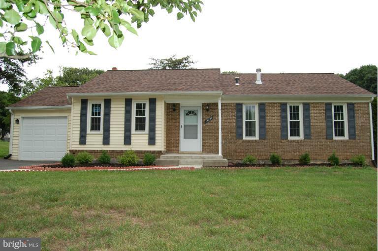 14300 Morton Hall Road Silver Spring, MD 20906 - Photo 18 of 18 a front view of a house with a garden and plants