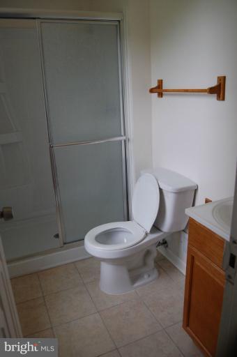 14300 Morton Hall Road Silver Spring, MD 20906 - Photo 3 of 18 a white toilet sitting next to a bathroom sink