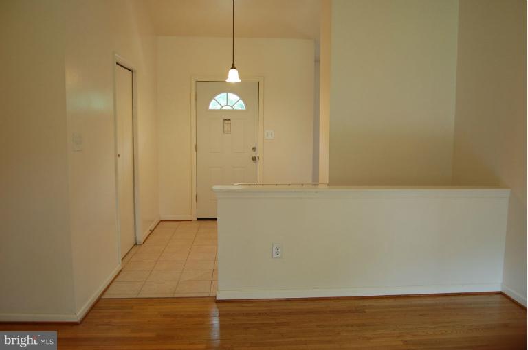 14300 Morton Hall Road Silver Spring, MD 20906 - Photo 8 of 18 a view of empty room with wooden floor