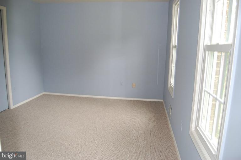 14300 Morton Hall Road Silver Spring, MD 20906 - Photo 9 of 18 a view of an empty room and window