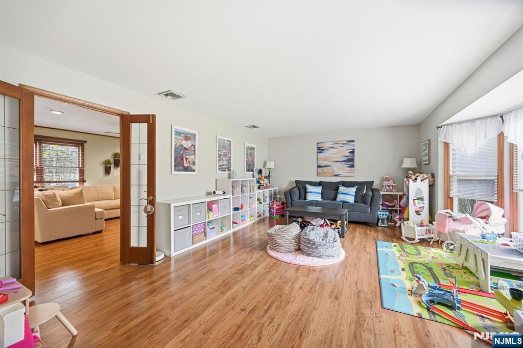 6 Robin Drive Oak Ridge, NJ 07438 - Photo 11 of 49 a living room with furniture and a wooden floor