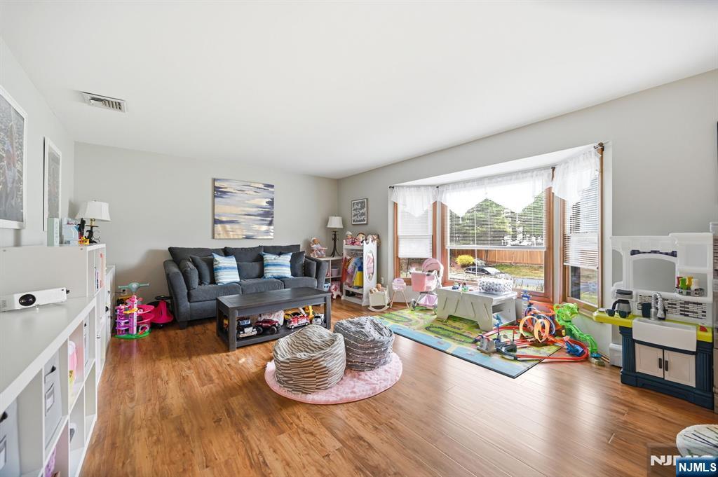 6 Robin Drive Oak Ridge, NJ 07438 - Photo 13 of 49 a living room with furniture and a wooden floor