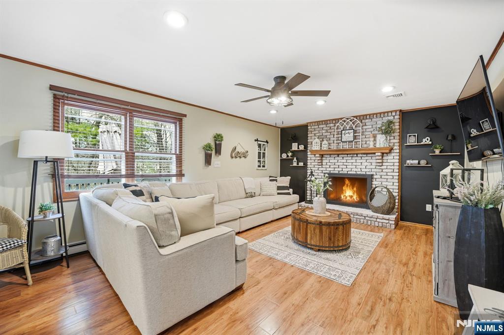 6 Robin Drive Oak Ridge, NJ 07438 - Photo 14 of 49 a living room with furniture and a fireplace