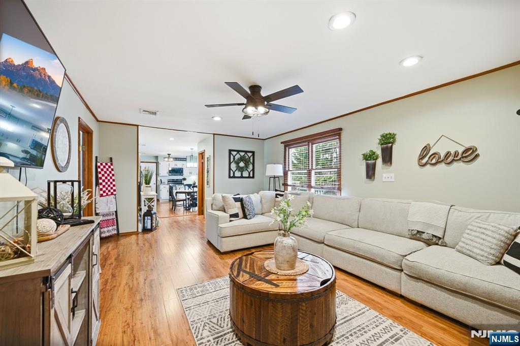 6 Robin Drive Oak Ridge, NJ 07438 - Photo 16 of 49 a living room with furniture and a ceiling fan