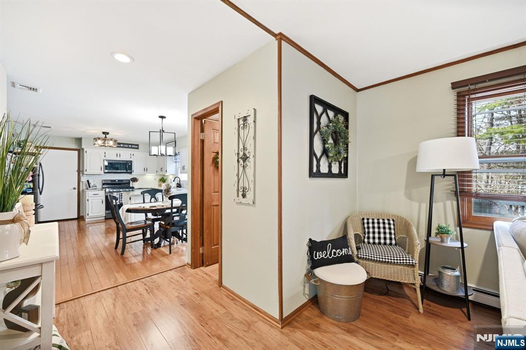 6 Robin Drive Oak Ridge, NJ 07438 - Photo 17 of 49 a living room with furniture and wooden floor