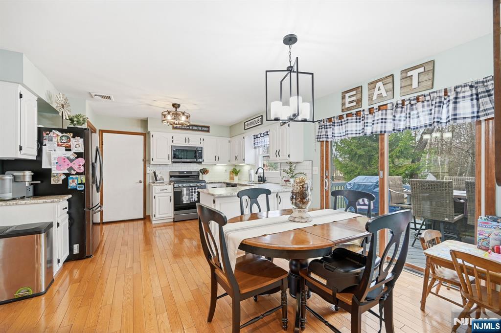 6 Robin Drive Oak Ridge, NJ 07438 - Photo 20 of 49 a view of a dining room with furniture window and outside view
