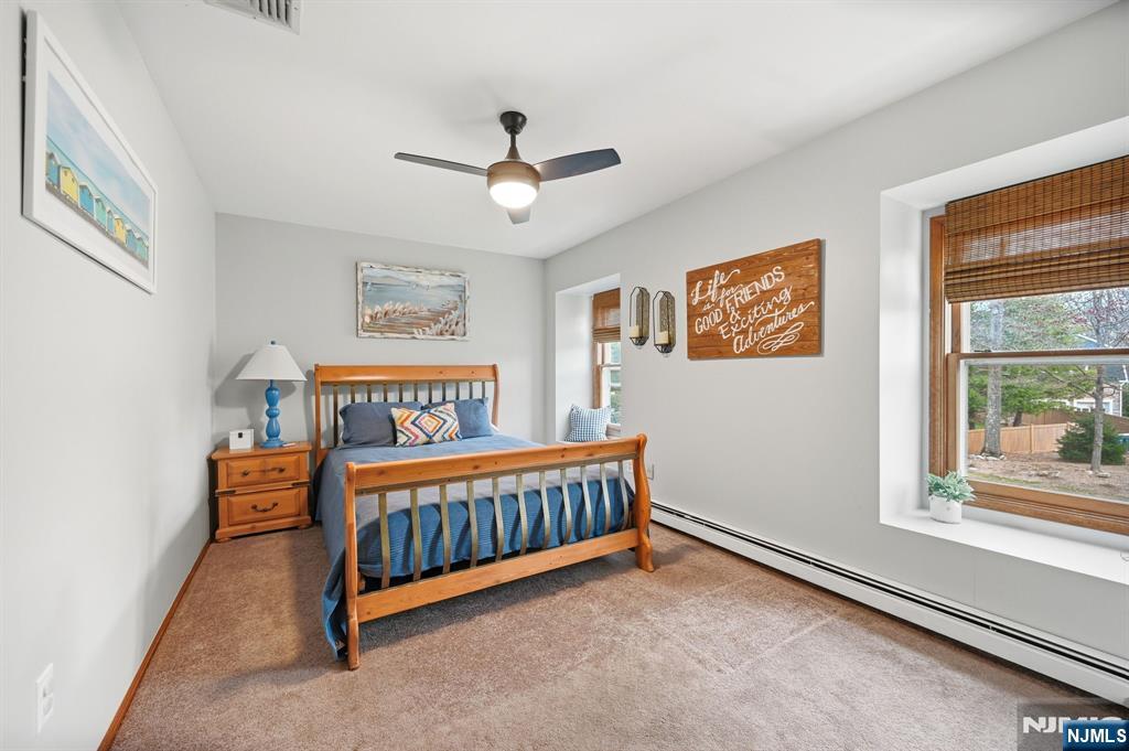 6 Robin Drive Oak Ridge, NJ 07438 - Photo 28 of 49 a bedroom with furniture and a window