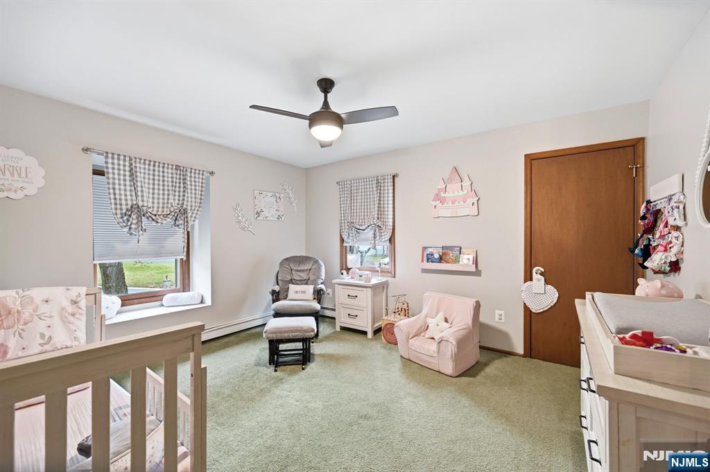 6 Robin Drive Oak Ridge, NJ 07438 - Photo 30 of 49 a living room with furniture and a large window