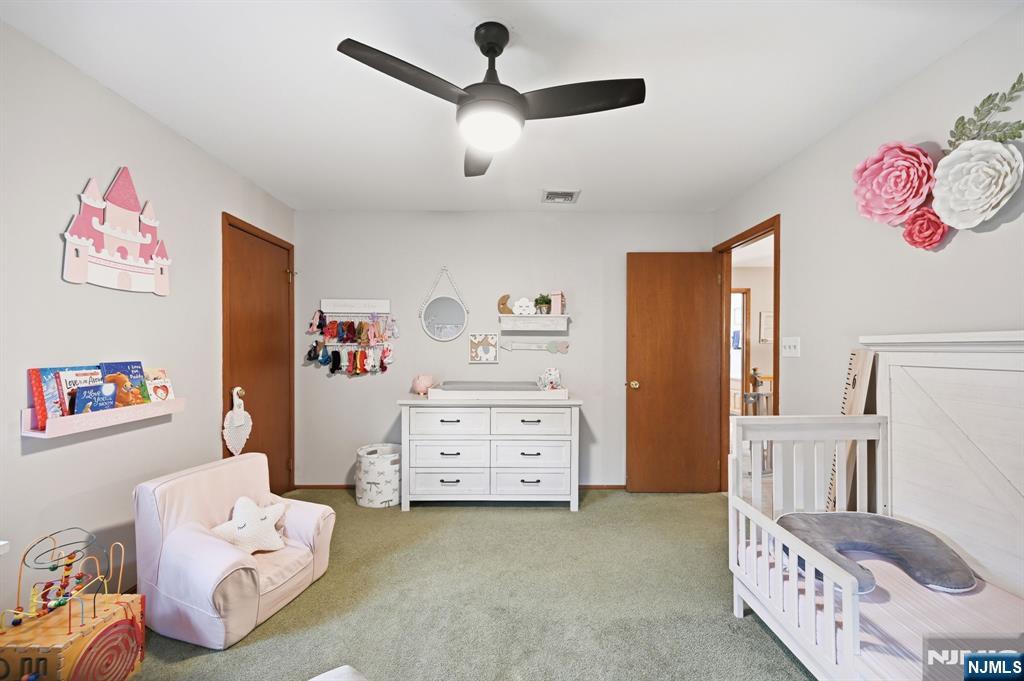 6 Robin Drive Oak Ridge, NJ 07438 - Photo 31 of 49 a bedroom with a bed and a dresser