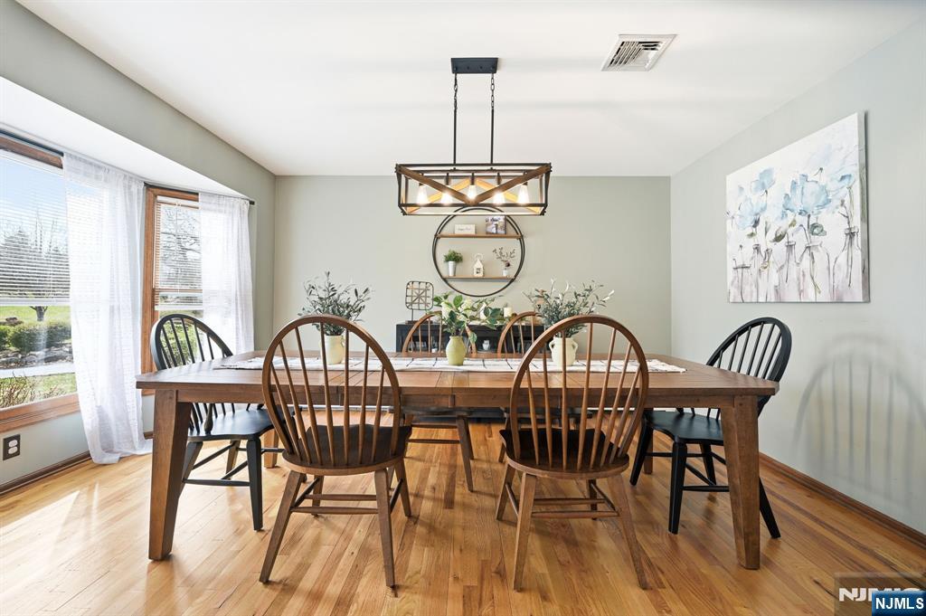 6 Robin Drive Oak Ridge, NJ 07438 - Photo 8 of 49 a view of a dining room with furniture window and wooden floor