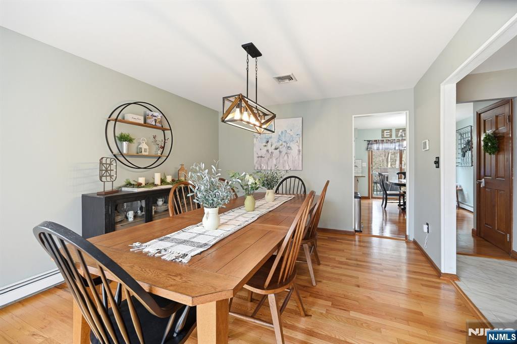6 Robin Drive Oak Ridge, NJ 07438 - Photo 9 of 49 a view of a dining room with furniture window and wooden floor