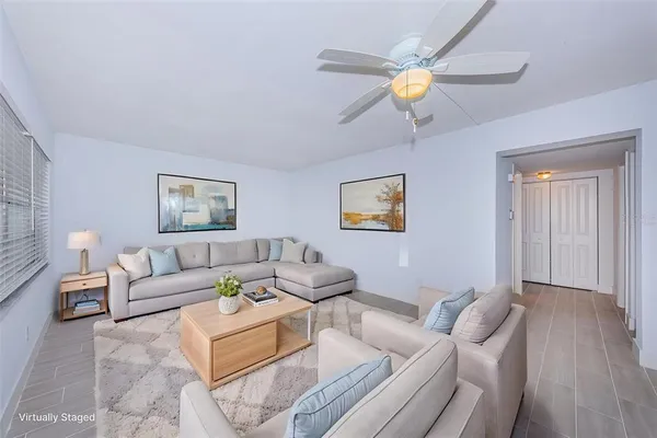 a view of a kitchen with a sink and a refrigerator