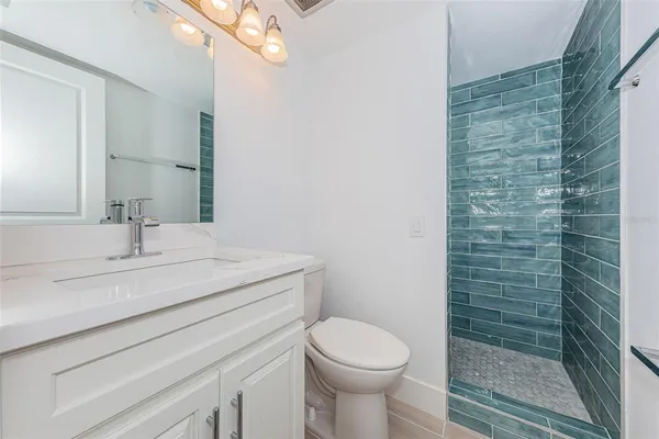 a view of a car is parked in front of a building