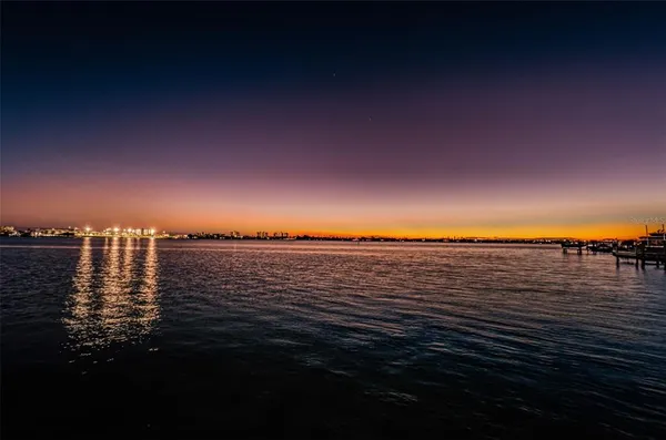 a view of street with parked cars