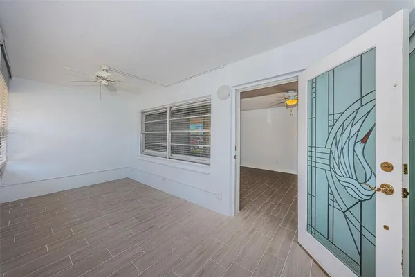 a kitchen with cabinets stainless steel appliances and a window