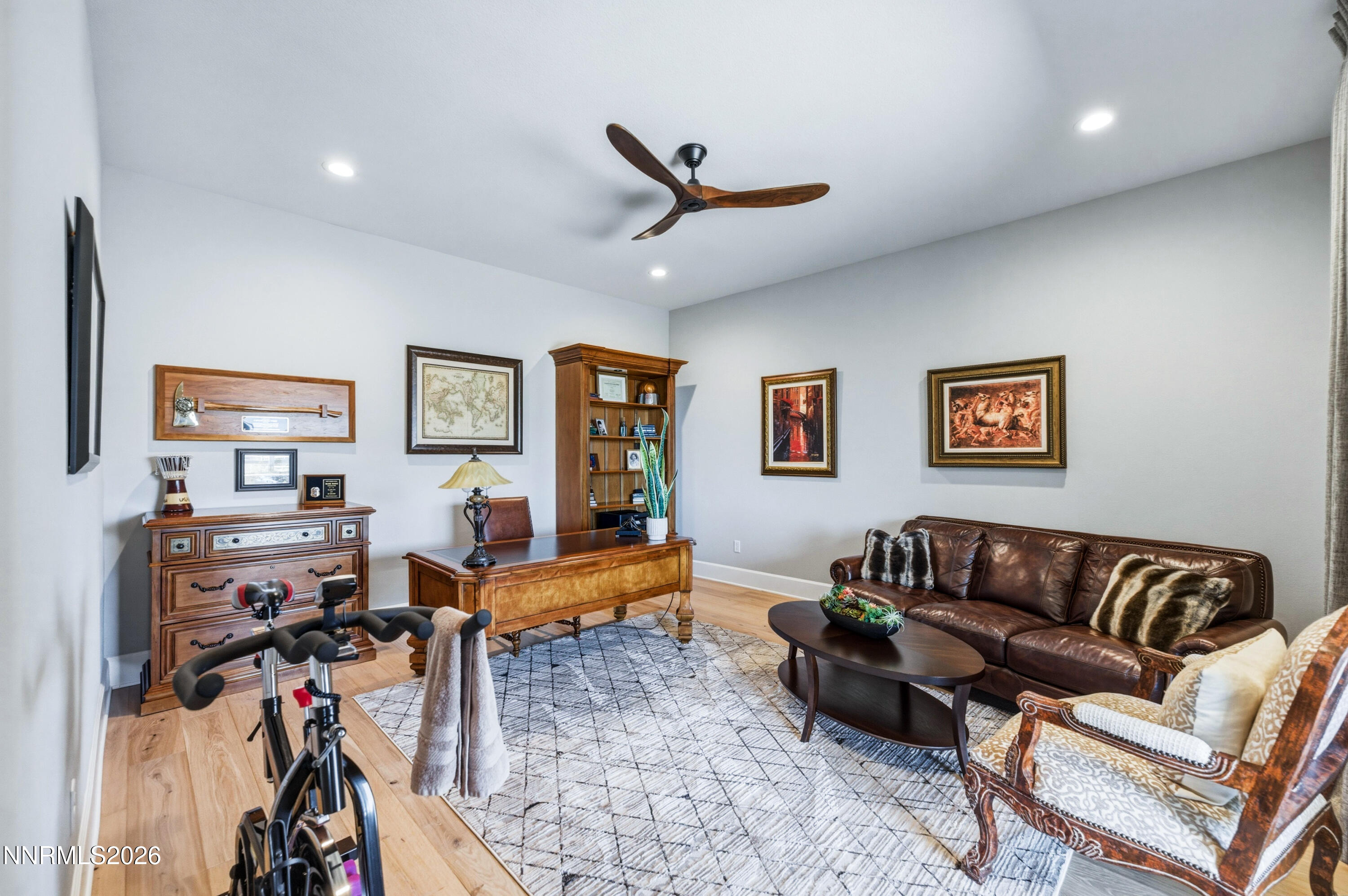 9028 Iron Sky Court Reno, NV 89523 - Photo 25 of 36 a living room with furniture or couch and a flat screen tv