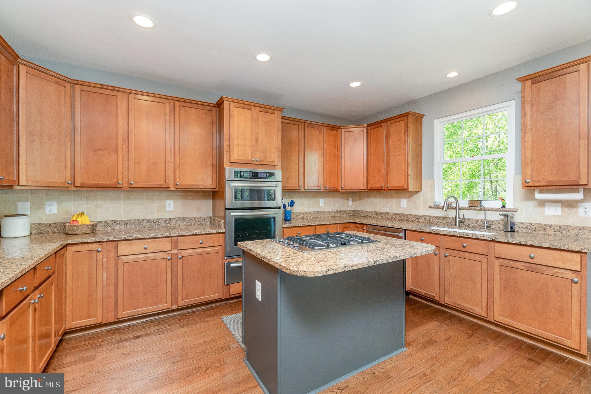 1326 Eagle Ridge Run Bel Air, MD 21014 - Photo 15 of 79 a kitchen with stainless steel appliances granite countertop refrigerator sink and cabinets