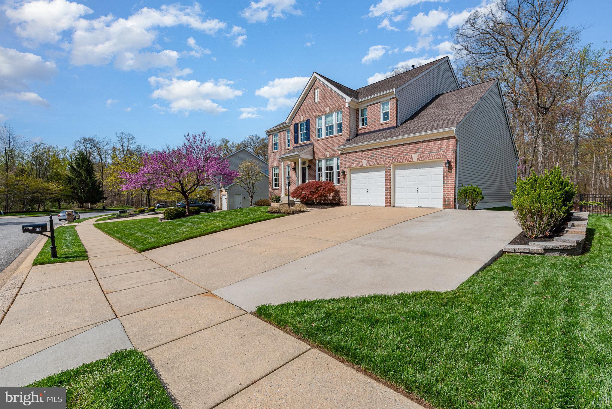 1326 Eagle Ridge Run Bel Air, MD 21014 - Photo 3 of 79 a front view of a house with a yard and potted plants