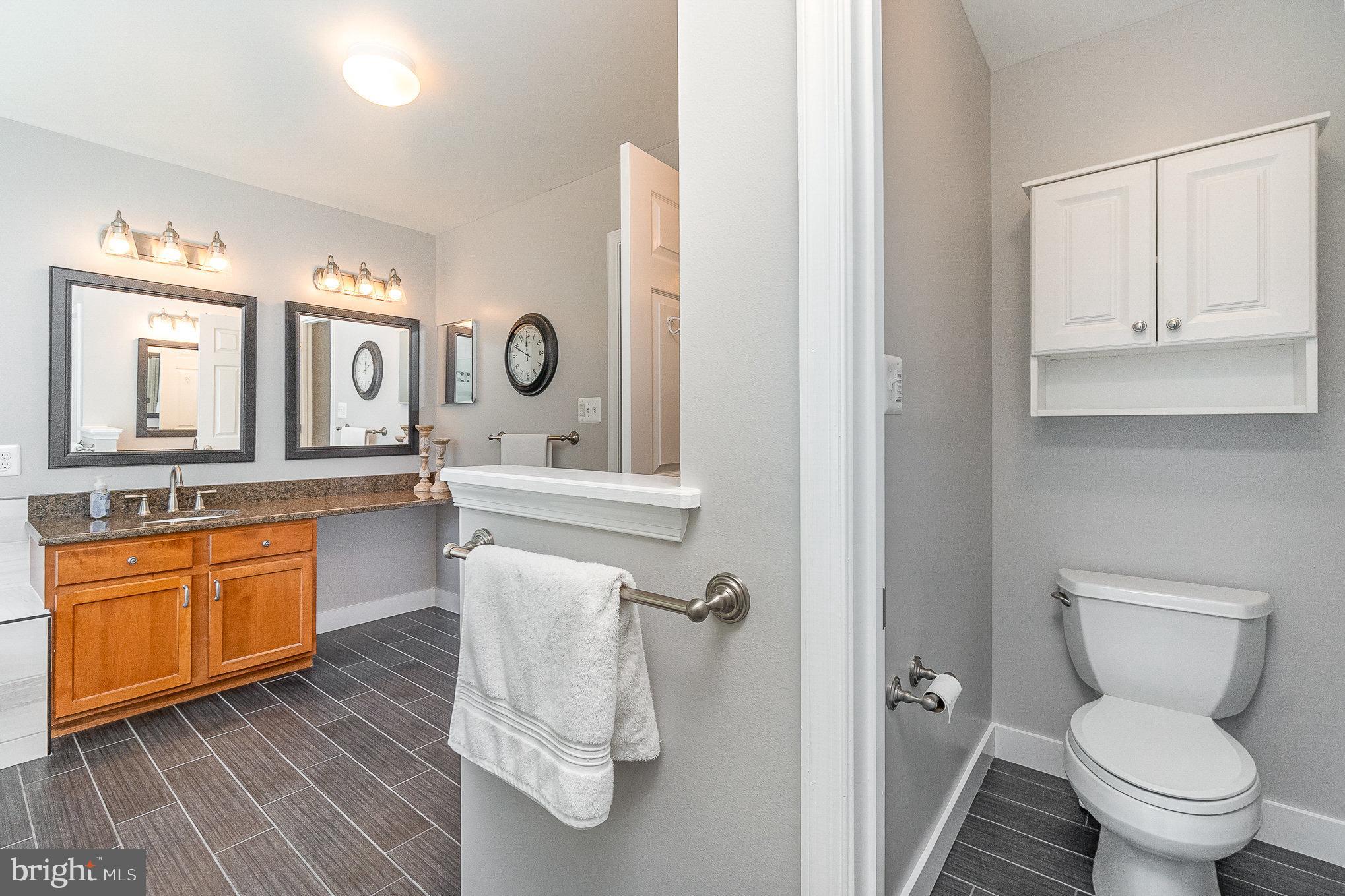 1326 Eagle Ridge Run Bel Air, MD 21014 - Photo 35 of 79 a bathroom with a granite countertop sink mirror vanity and a toilet