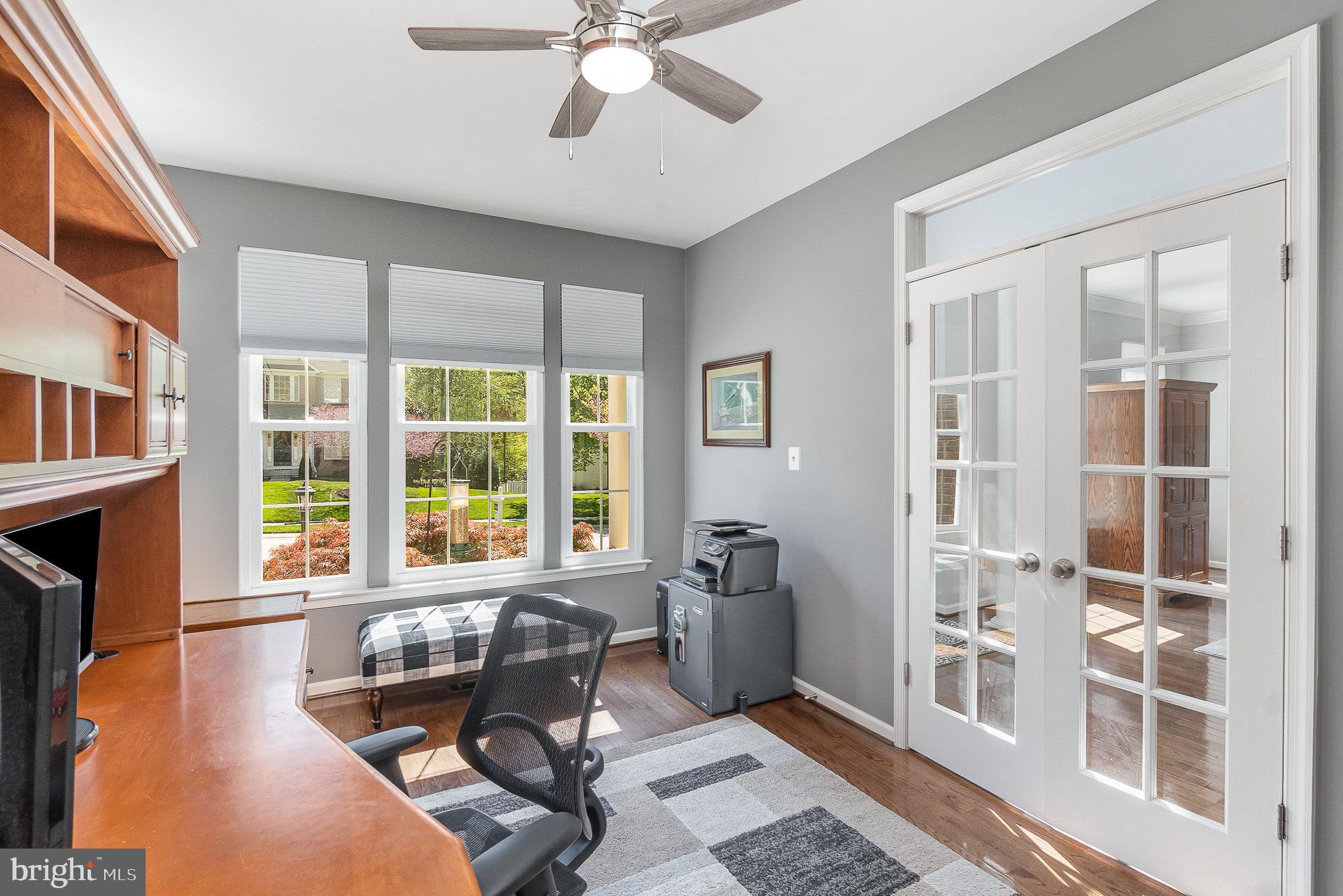 1326 Eagle Ridge Run Bel Air, MD 21014 - Photo 10 of 79 a living room with furniture a fireplace and a large window